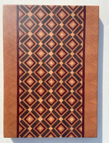 Finished diamond end-grain board viewed from above, with pale accent diamonds between the larger patterned diamonds